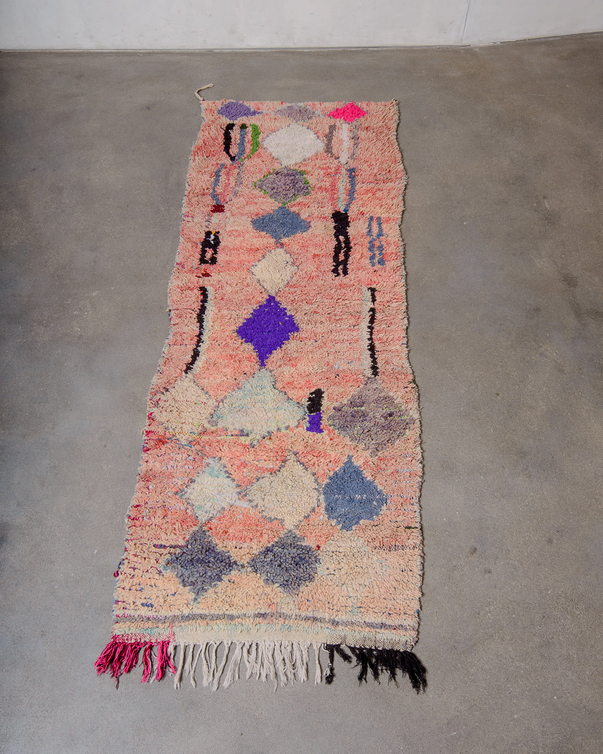 Modern designer vintage handcrafted Berber rug from Morocco. Boucherouite runner rug with beautiful colors and patterns.